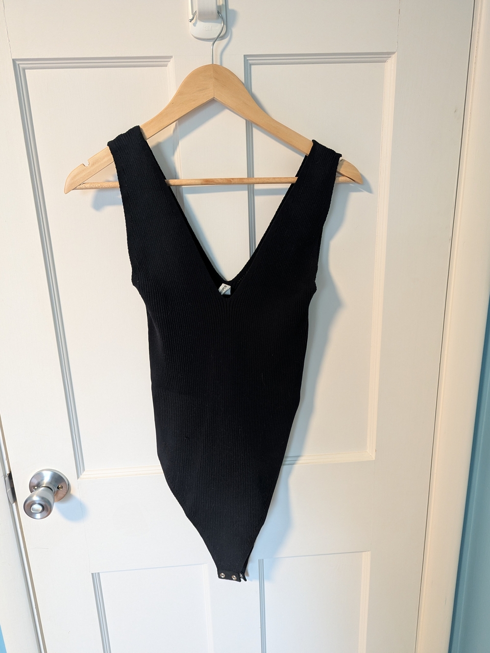 Wishlist Black Ribbed V‑Neck One‑Piece Bodysuit